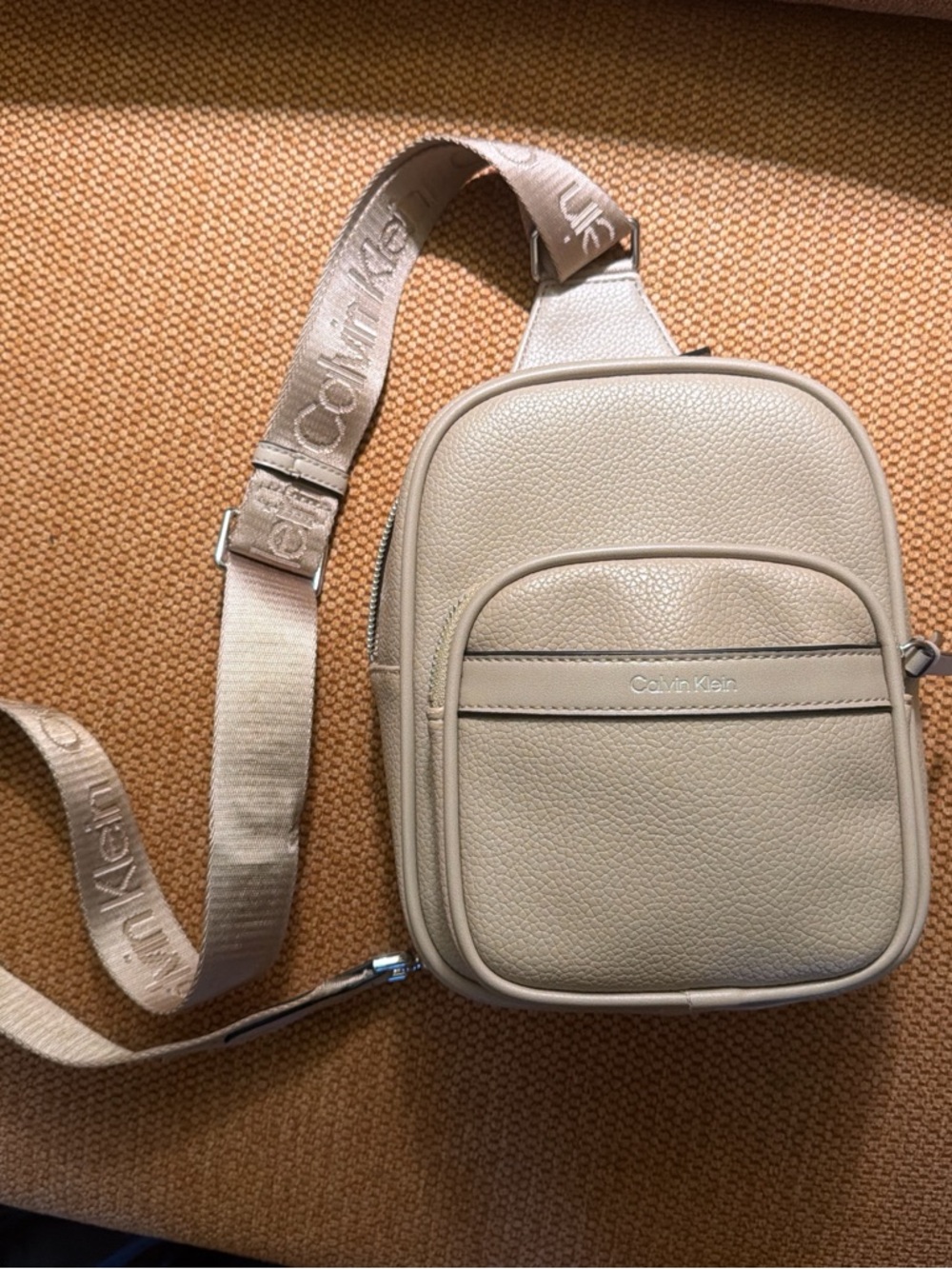 Calvin Klein Taupe Pebbled Leather Sling Bag with Branded Strap